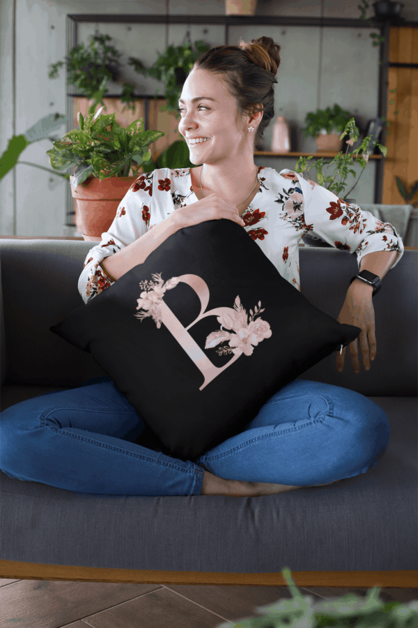 Custom Printed Monogram Letter B on Black Pillow Case mockup of a smiling woman holding a pillow