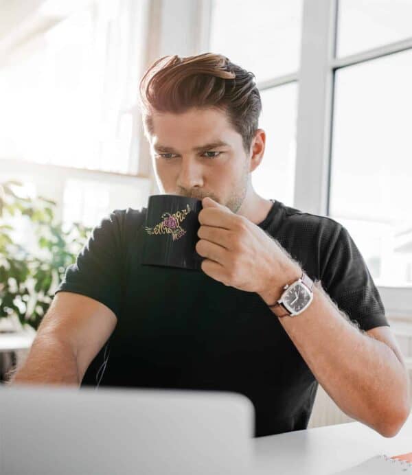 Follow Your Heart Coffee Mug Design Black 11oz coffee mug mockup featuring a man working from home