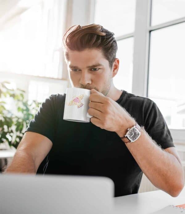 Follow Your Heart Coffee Mug Design White 11oz coffee mug mockup featuring a man working from home