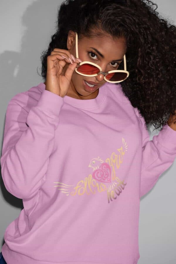 Follow Your Heart Crewneck Sweat Shirt Design Cyber Pink sweatshirt mockup of a woman with sunglasses smirking