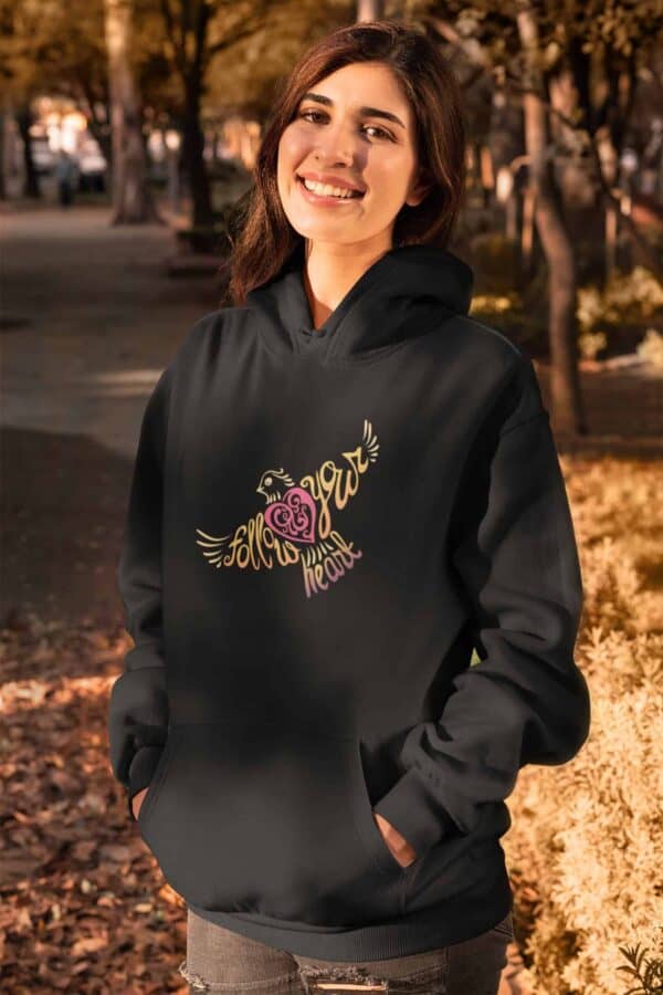 Follow Your Heart Hoodie Design Black mockup of a woman wearing a pullover hoodie in fall