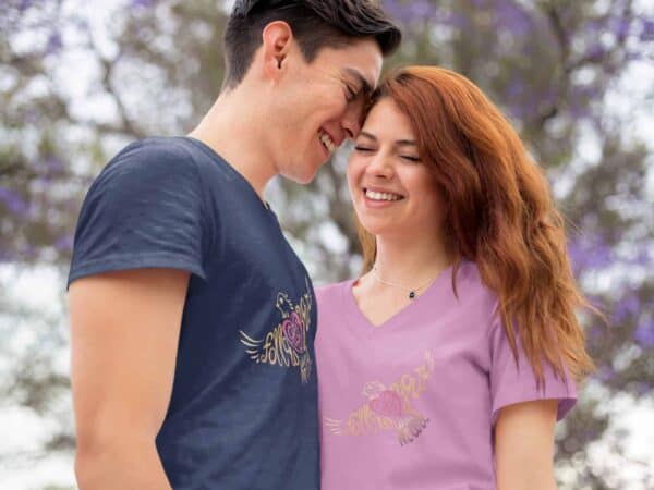 Follow Your Heart Ladies V-Neck T-Shirt Inspirational Design romantic young couple wearing a navy round neck and a Cyber Pink v-neck tshirt mockup while outdoors