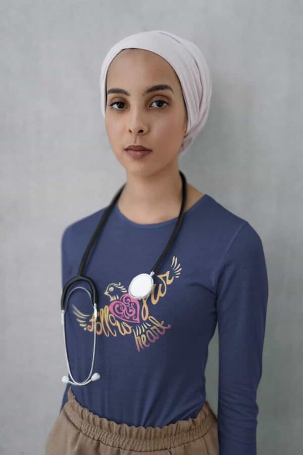 Follow Your Heart Long Sleeve T-Shirt Inspirational Design mockup of a doctor with a stethoscope