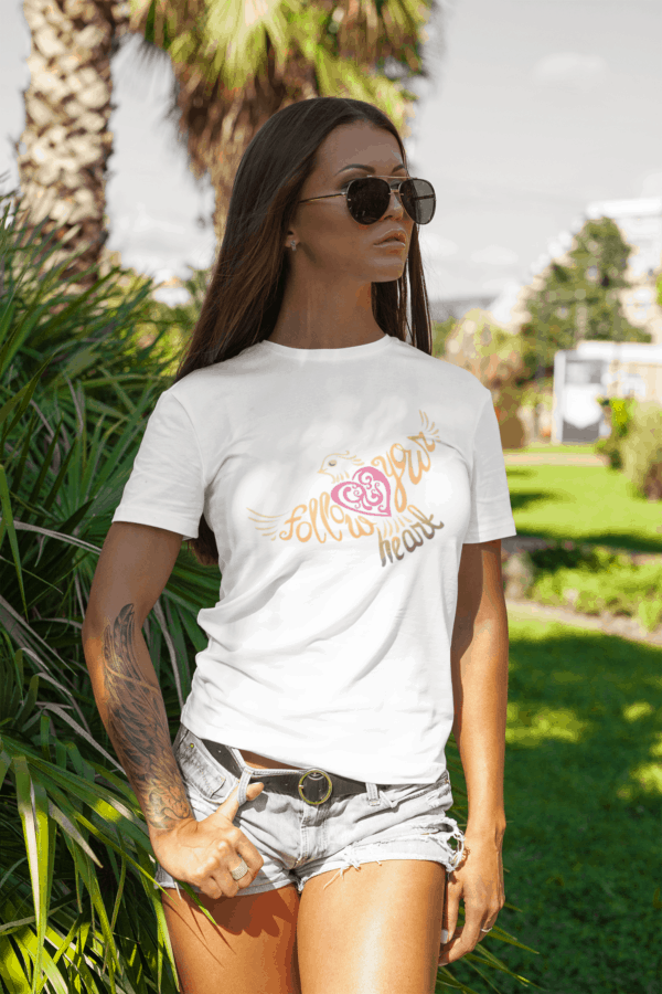 Follow Your Heart T-Shirt Design mockup of a stylish tattooed woman at a park