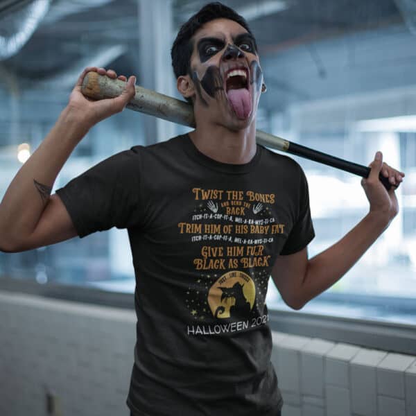 Man in Halloween costume holding a bat in a Twist The Bones Custom Halloween T-shirt